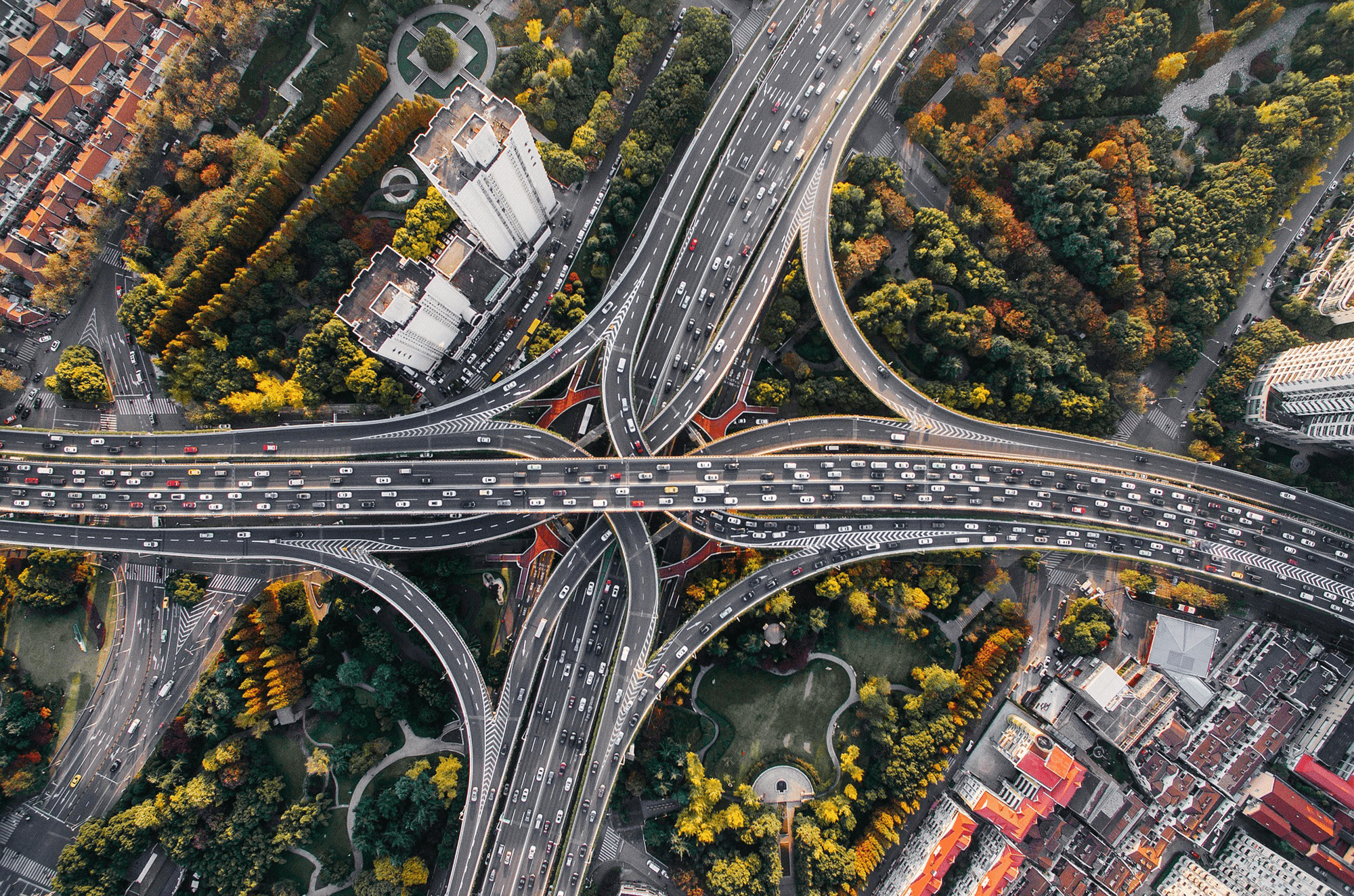 Aerial shot of cars emitting black carbon into atmosphere