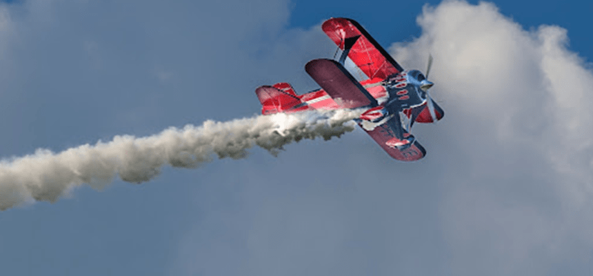 air plane emitting pollution into sky