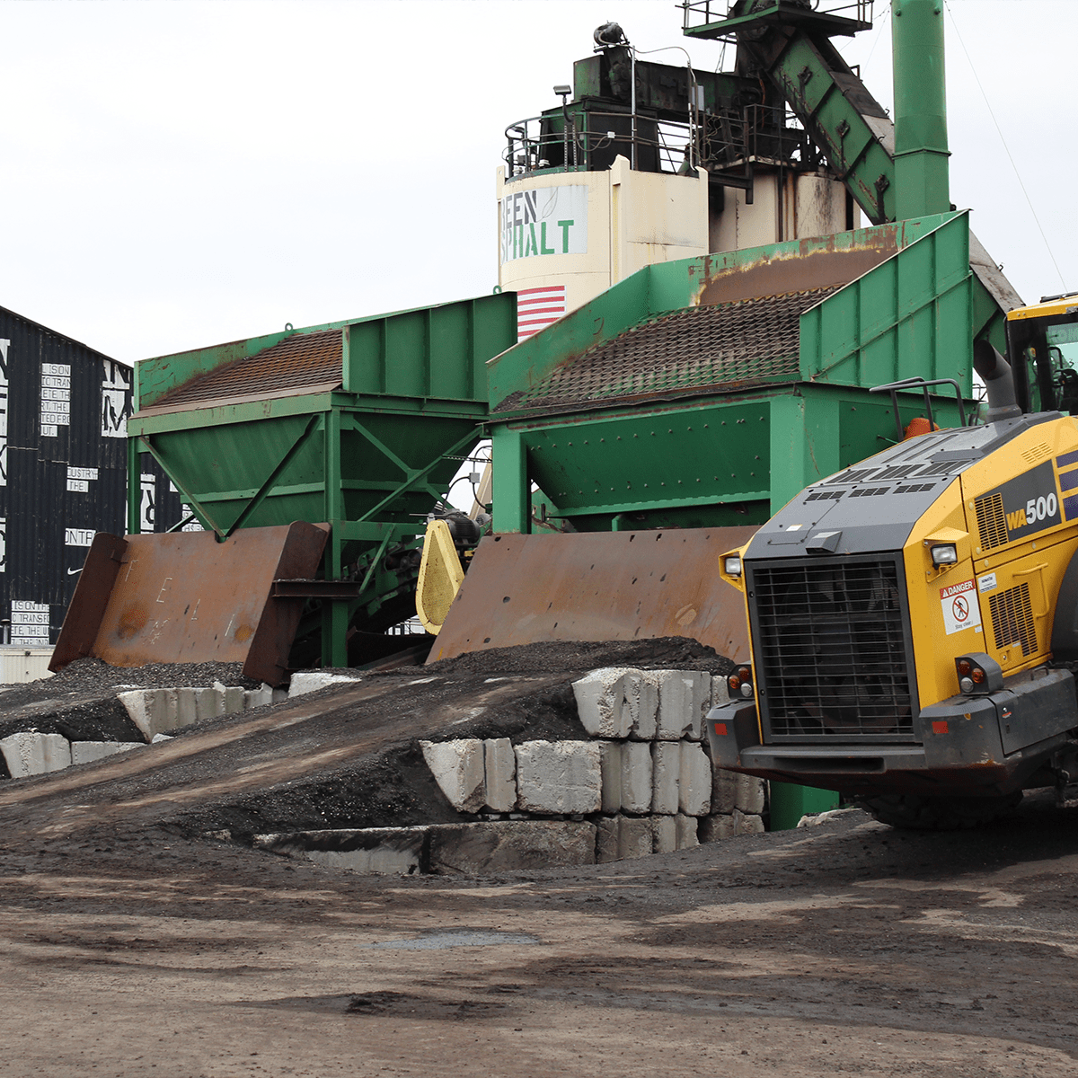 Green Asphalt equipment that breaks up concrete