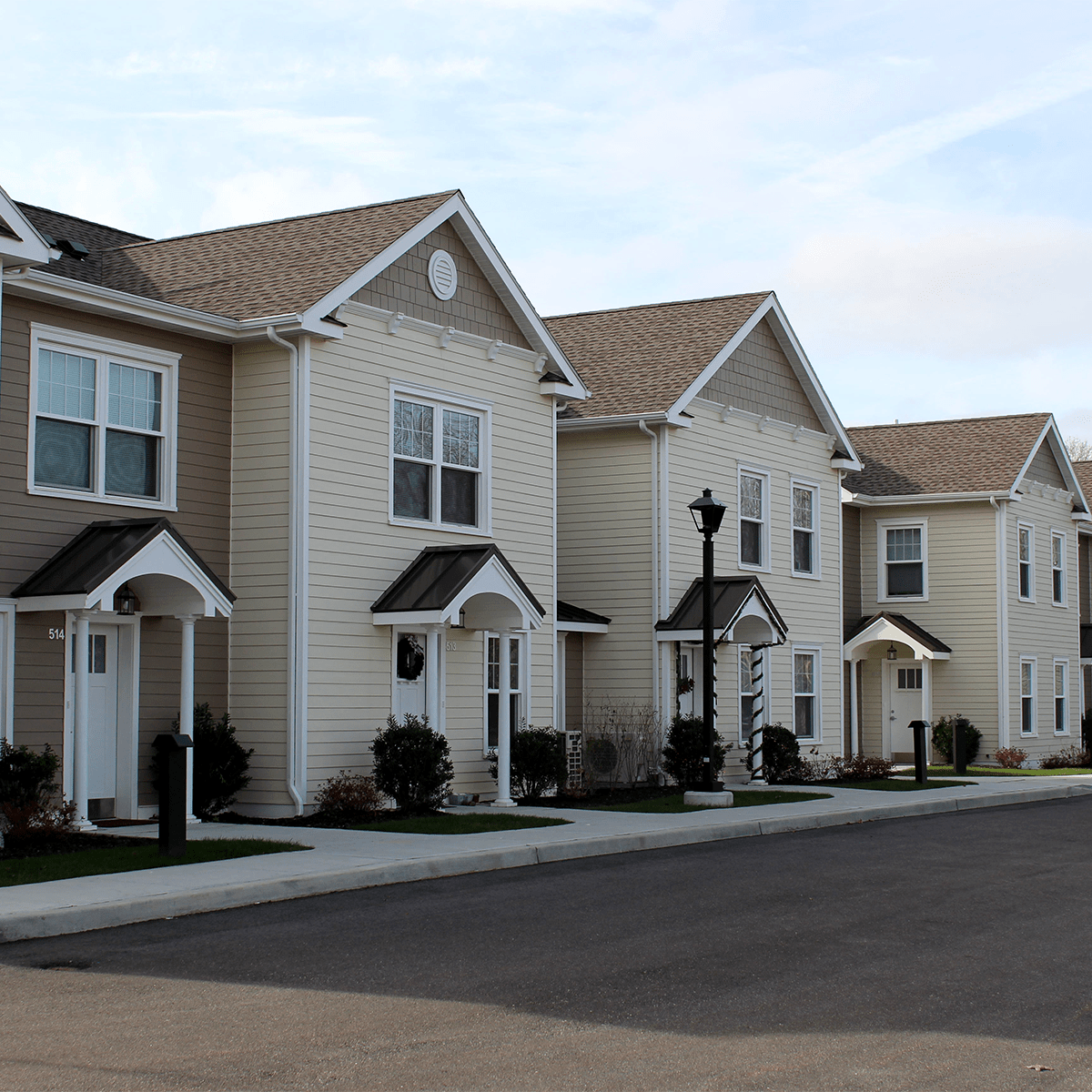 Row of four apartments in the shade