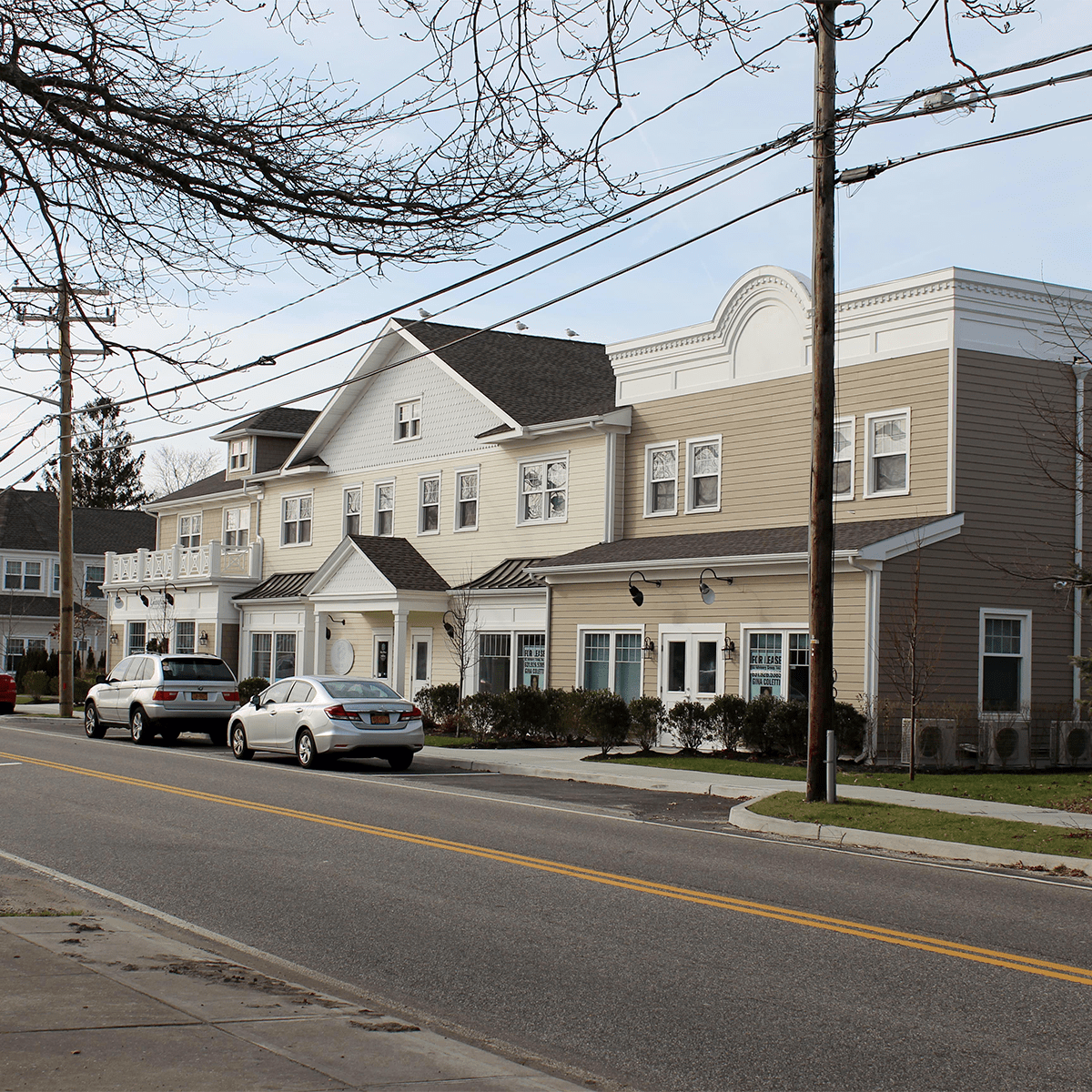 Street View of buildings with store fronts on lower level