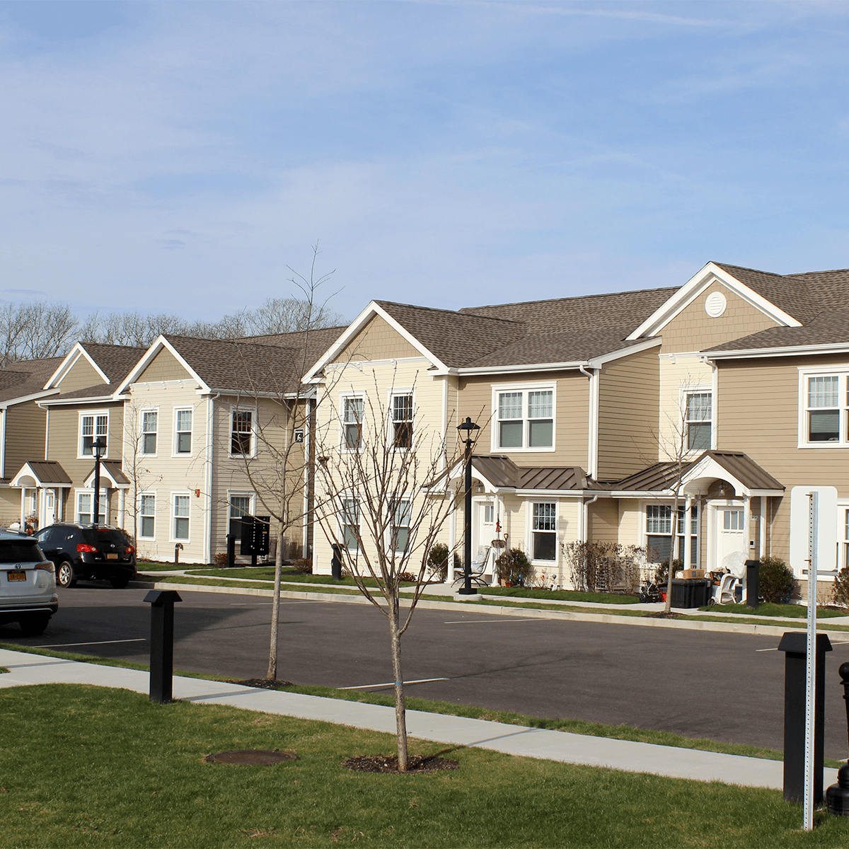 Speonk apartments in sunlight parking lot angle